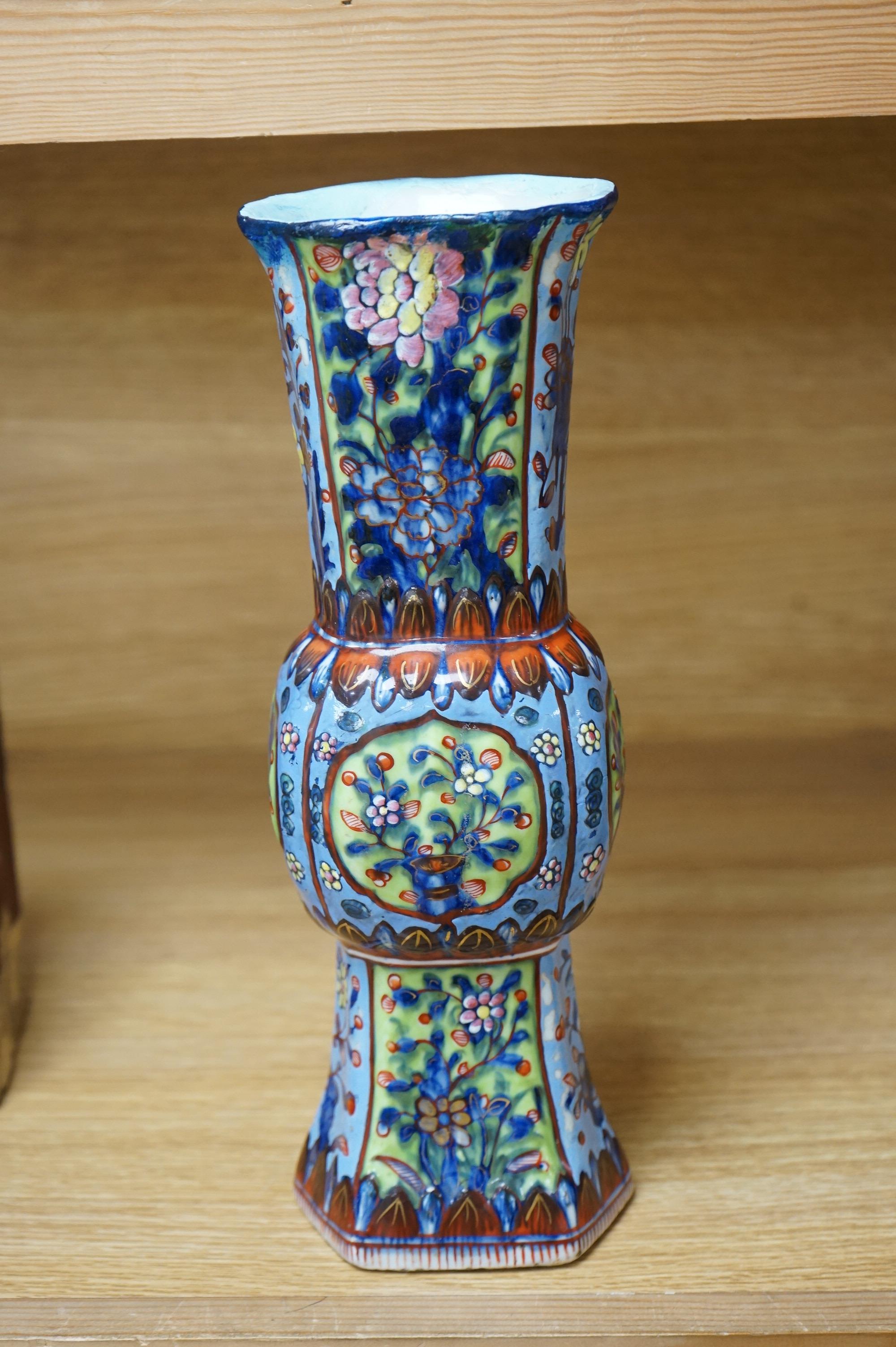 A Chinese clobbered Gu shaped vase, 30cm high. Condition - restored